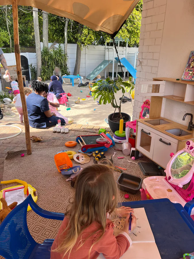 The covered play patio and sandpit on the Luxe & Little property, where Gray's Eatery is