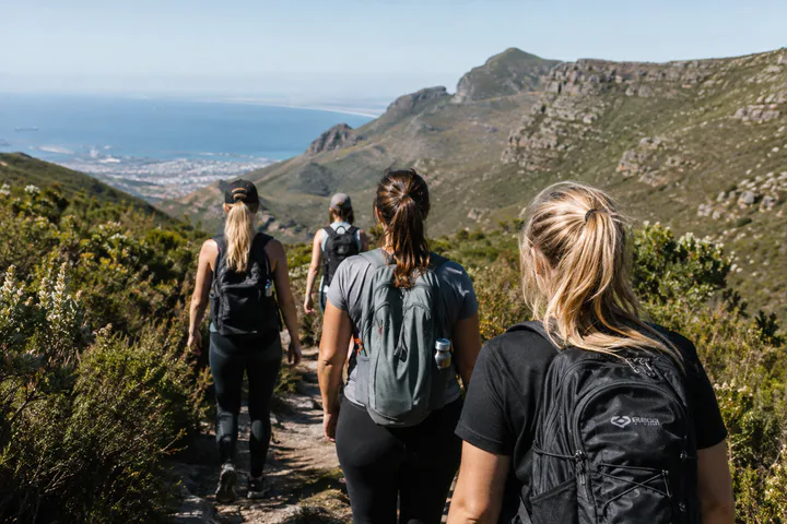 A group of women hiking on a Cape Town mountain trail