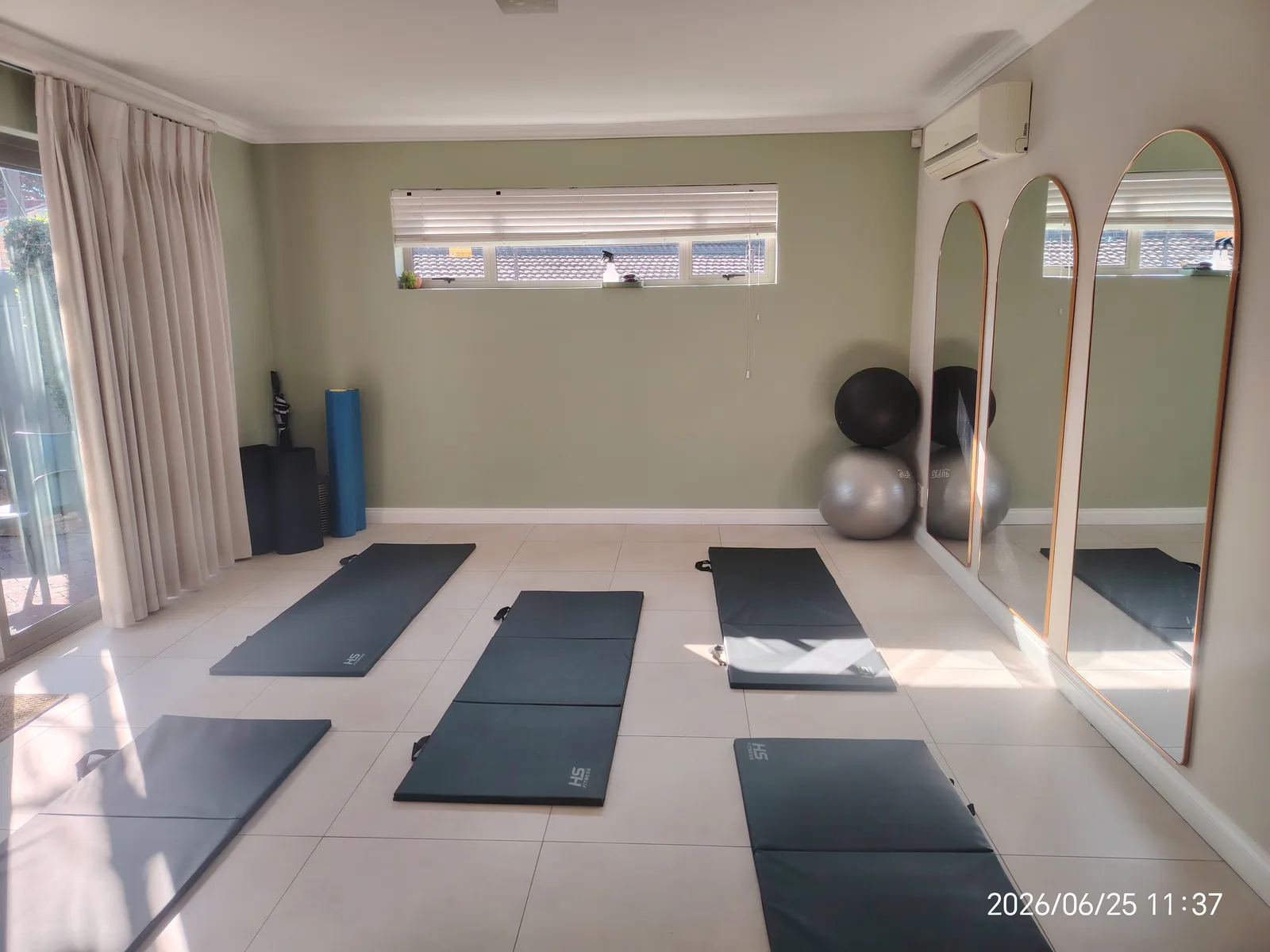 Pilates mats set out in Sarah Goodwin’s studio