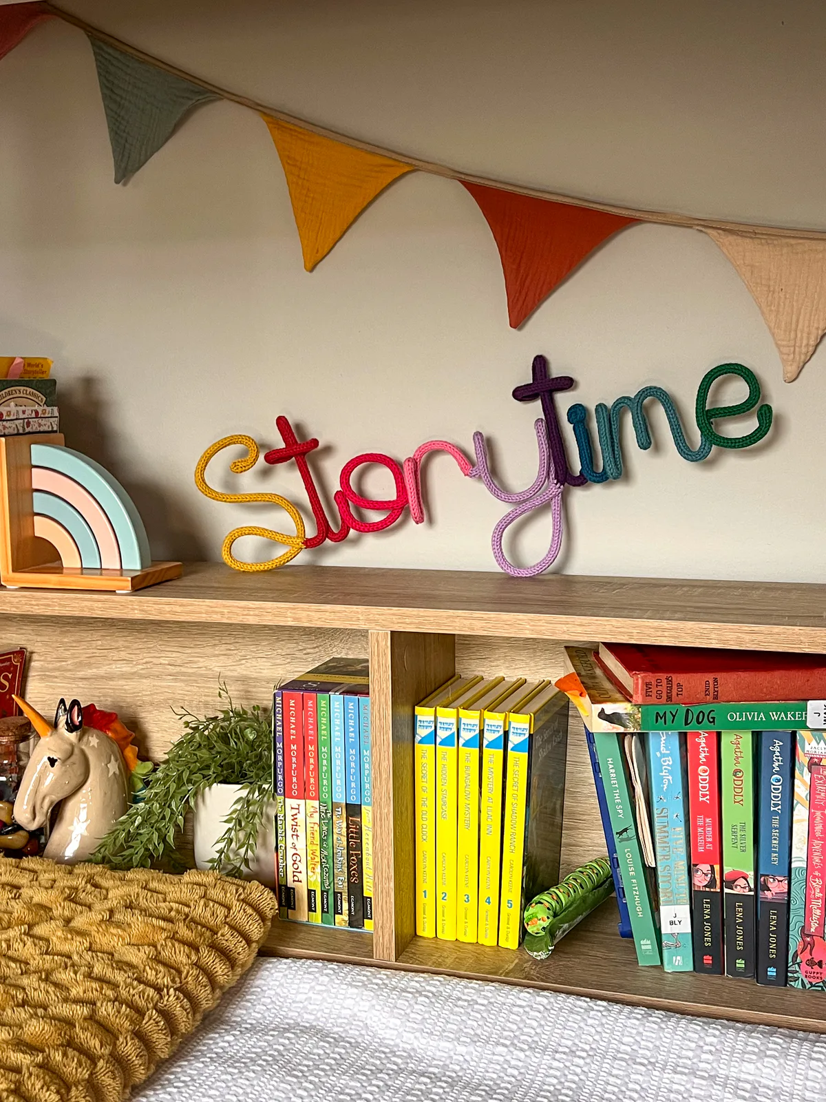 Colourful knitted Storytime sign in a child’s room