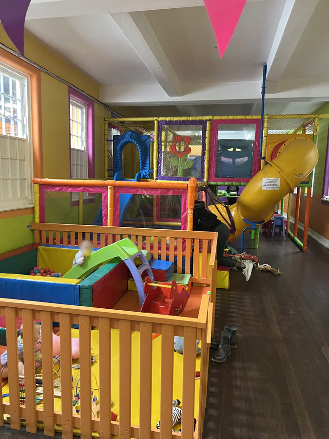The colourful indoor play area at The Play Shed