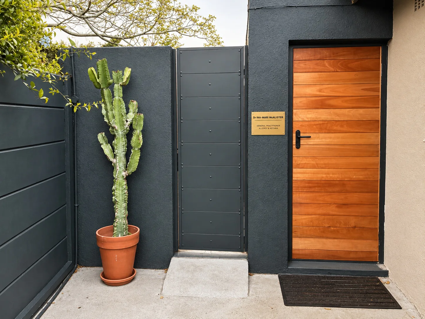 The practice entrance, with Dr Ina-Mari McAlister's nameplate beside the wooden door
